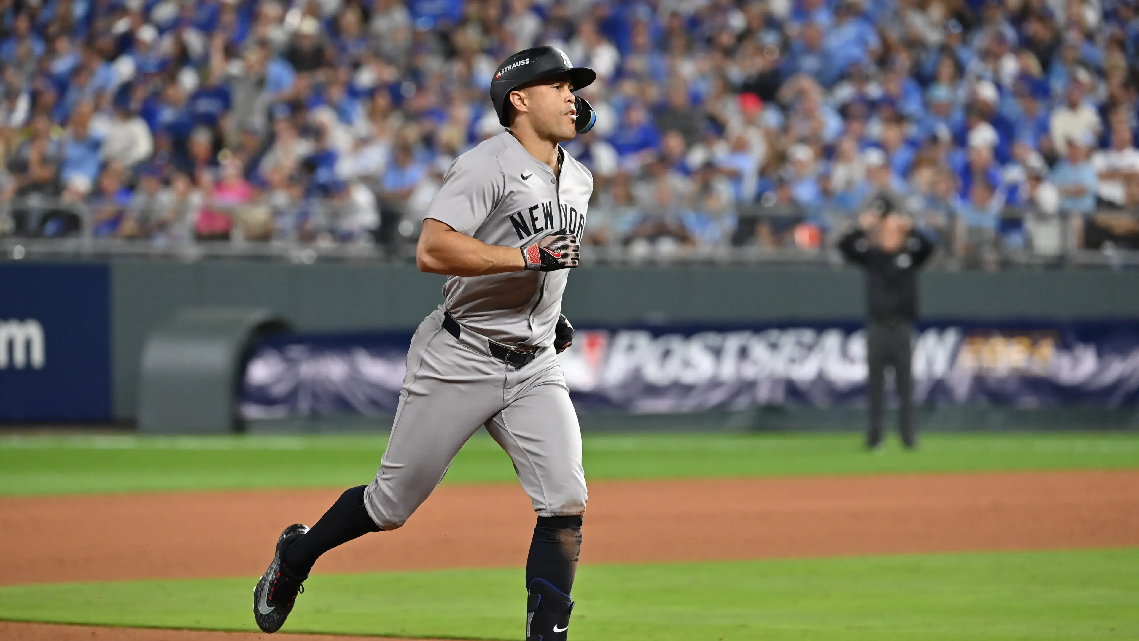 Oct 9, 2024; Kansas City, Missouri, USA; New York Yankees designated hitter Giancarlo Stanton (27) runs the bases after hitting a home run in the eighth inning against the Kansas City Royals during game three of the NLDS for the 2024 MLB Playoffs at Kauffman Stadium. Mandatory Credit: Peter Aiken-Imagn Images / © Peter Aiken-Imagn Images