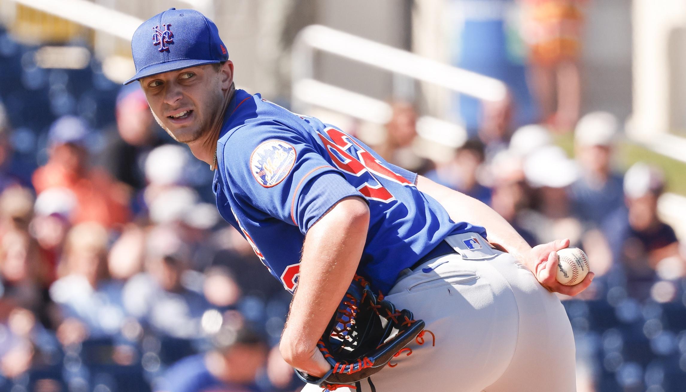 New York Mets starting pitcher Eric Orze (92) checks the runner at first base during the sixth inning against the Houston Astros at The Ballpark of the Palm Beaches.