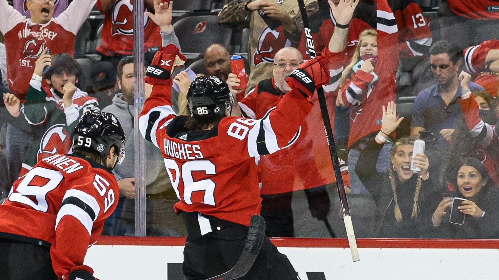 Oct 15, 2021; Newark, New Jersey, USA; New Jersey Devils center Jack Hughes (86) celebrates his goal with center Janne Kuokkanen (59) during the second period against the Chicago Blackhawks at Prudential Center. Mandatory Credit: Vincent Carchietta-USA TODAY Sports