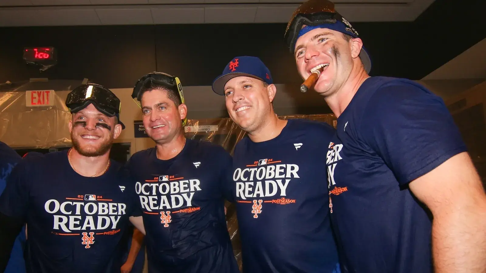 New York Mets center fielder Harrison Bader (44) and manager Carlos Mendoza (64) and first baseman Pete Alonso (20) celebrate clinching a wild card playoff birth after a game against the Atlanta Braves at Truist Park. / Brett Davis-Imagn Images