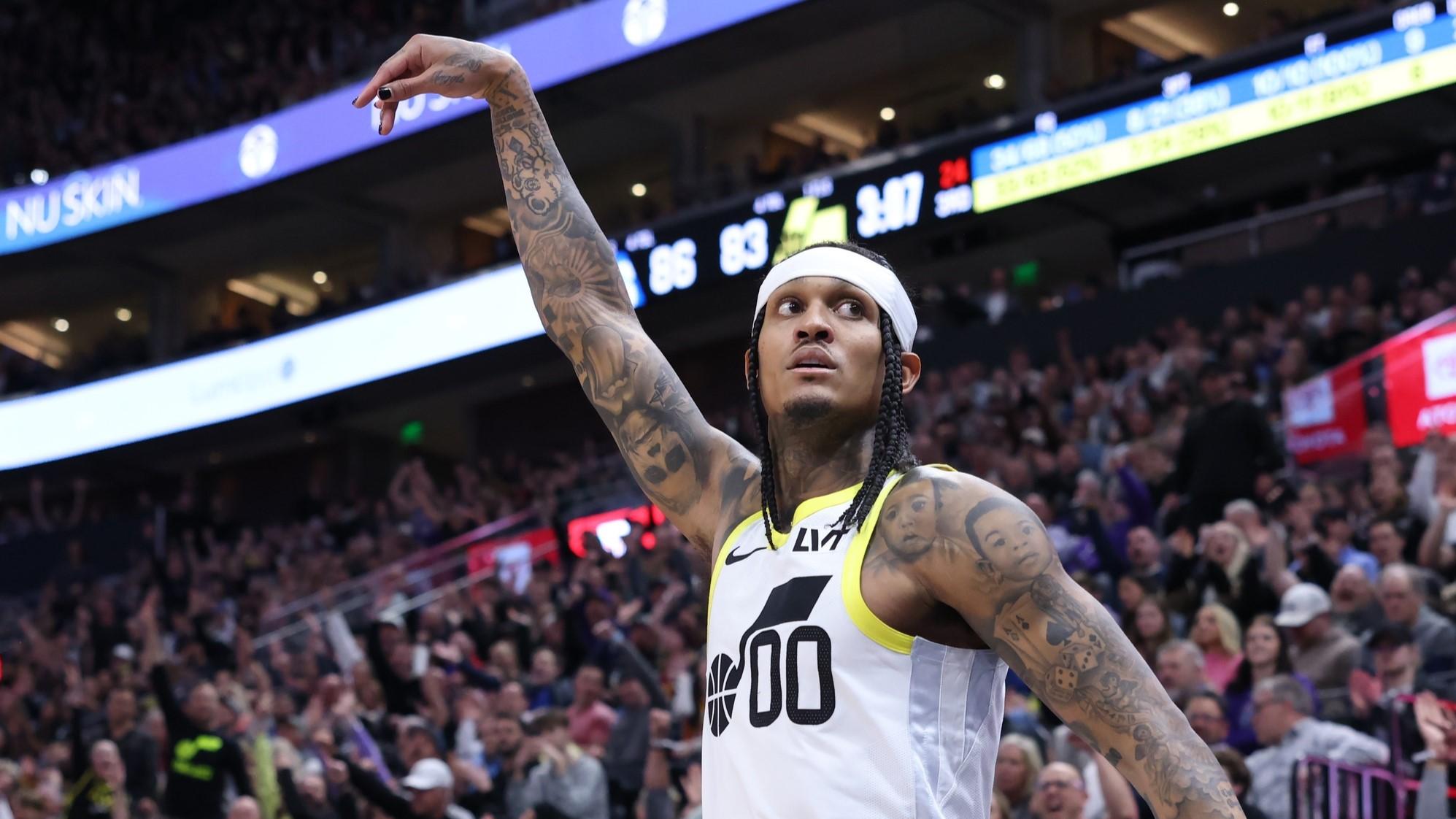 Feb 1, 2024; Salt Lake City, Utah, USA; Utah Jazz guard Jordan Clarkson (00) holds his follow through after making a three point shot against the Philadelphia 76ers during the third quarter at Delta Center.