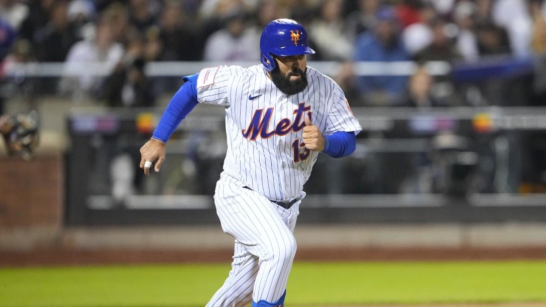 New York Mets second baseman Luis Guillorme runs out a bunt for a base hit against the San Diego Padres during the seventh inning.