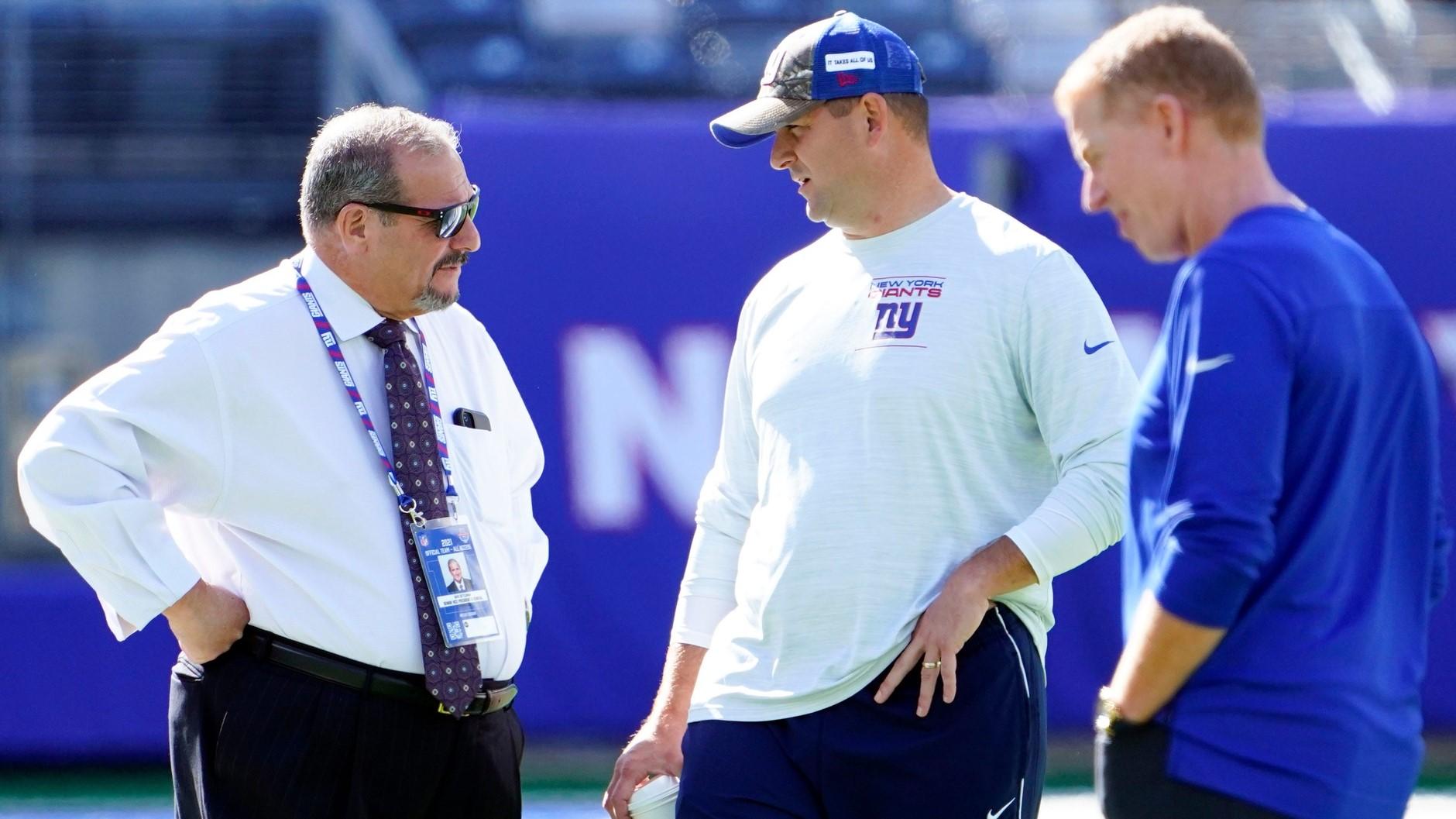 (from left) New York Giants general manager Dave Gettleman, head coach Joe Judge, and offensive coordinator Jason Garrett on the field before the game at MetLife Stadium on Sunday, Sept. 26, 2021, in East Rutherford.