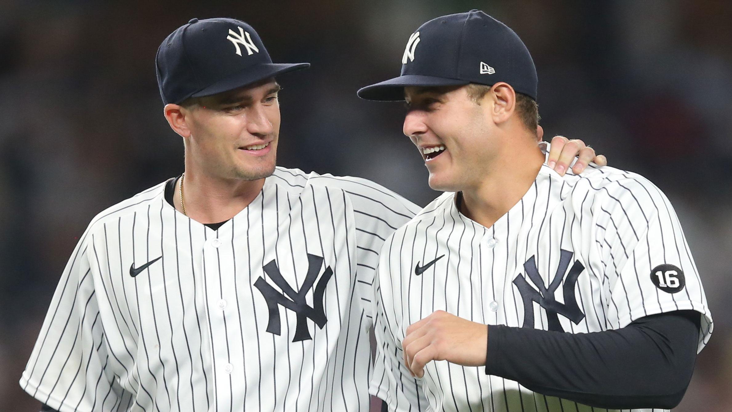 Aug 18, 2021; Bronx, New York, USA; New York Yankees starting pitcher Andrew Heaney (38) puts his arm around first baseman Anthony Rizzo (48) after the two collided catching a pop fly by Boston Red Sox catcher Christian Vazquez (not pictured) during the fifth inning at Yankee Stadium.