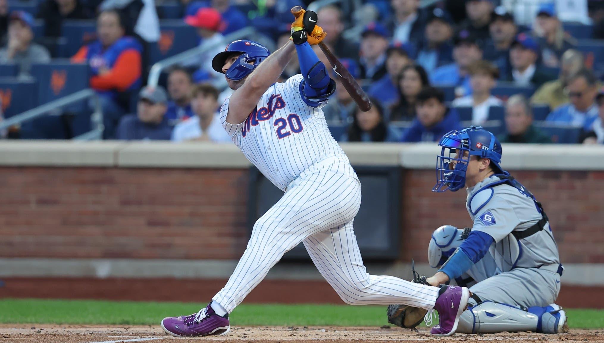 New York Mets first base Pete Alonso (20) hits a three-run home run in the first inning against the Los Angeles Dodgers during game five of the NLCS for the 2024 MLB playoffs at Citi Field. / Brad Penner-Imagn Images