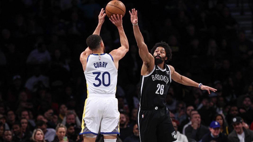 Golden State Warriors guard Stephen Curry (30) shoots the ball as Brooklyn Nets guard Spencer Dinwiddie (26) defends during the first quarter against the Brooklyn Nets at Barclays Center.