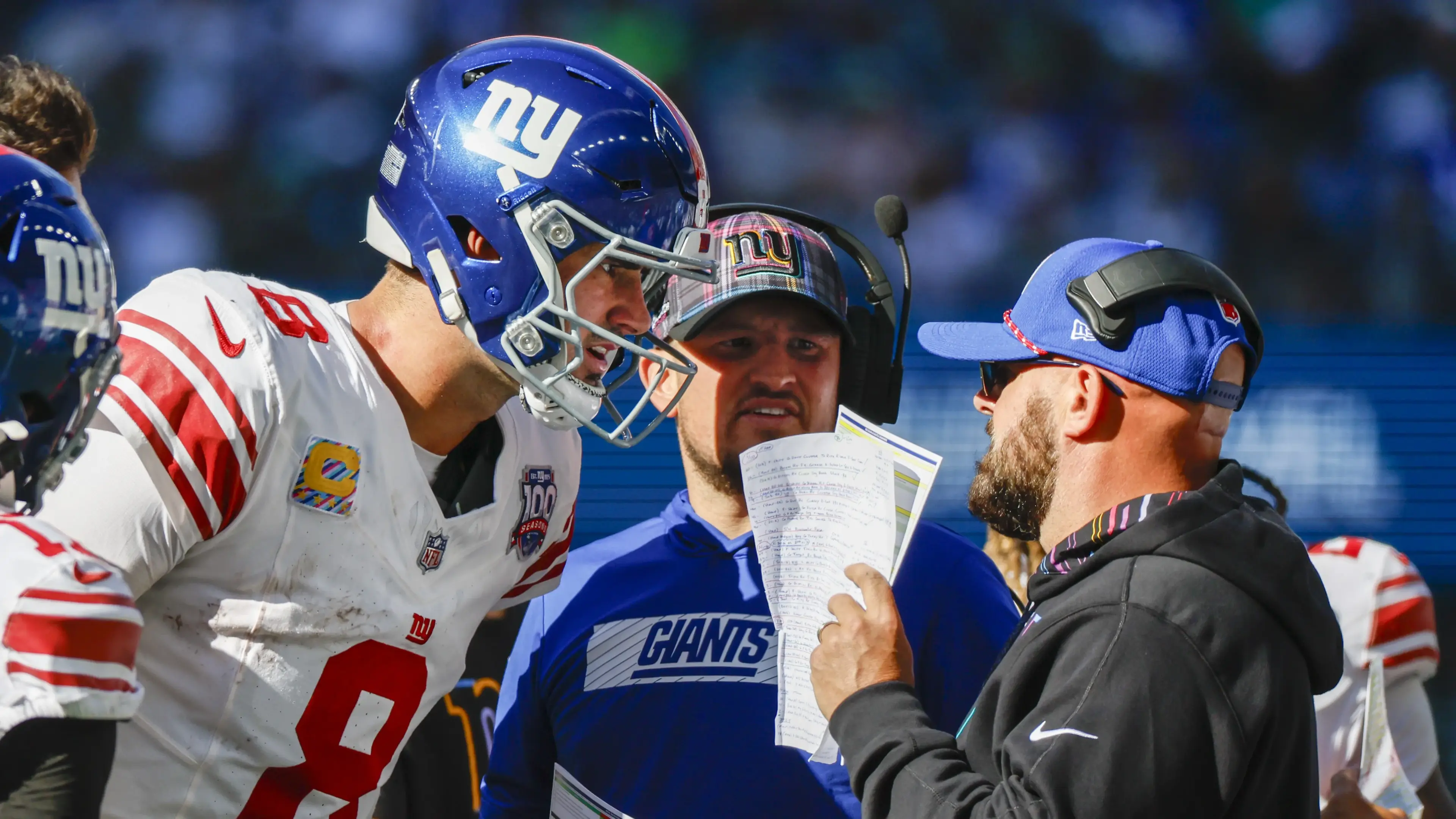 New York Giants quarterback Daniel Jones (8) talks with head coach Brian Daboll, right) during the second quarter against the Seattle Seahawks at Lumen Field. New York Giants quarterbacks coach Shea Tierney stands in the middle. / Joe Nicholson - Imagn Images