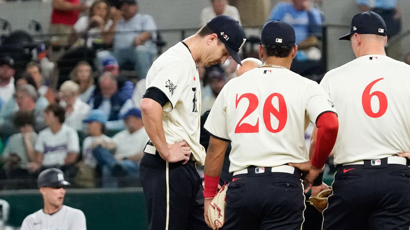 Apr 28, 2023; Arlington, Texas, USA; Texas Rangers starting pitcher Jacob deGrom (48) is visited on the mound by teammates and pitching coach pitching coach Mike Maddux (31) before leaving the game in the fourth inning against the New York Yankees at Globe Life Field.