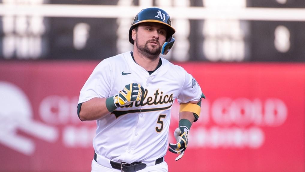 designated hitter J.D. Davis (5) rounds the bases after hitting a home run against the Colorado Rockies during the third inning at Oakland-Alameda County Coliseum. 