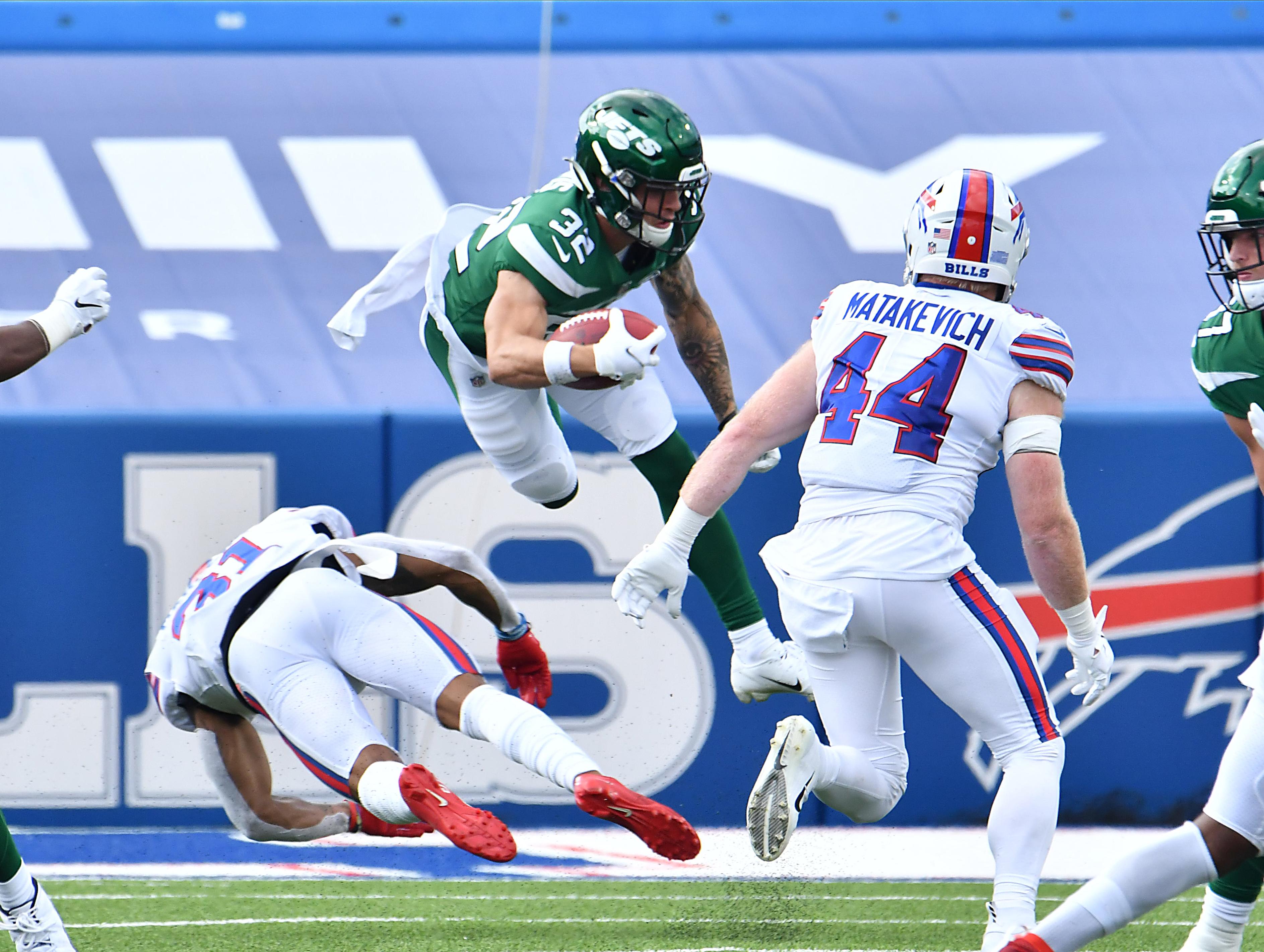 Sep 13, 2020; Orchard Park, New York, USA; New York Jets safety Ashtyn Davis (32) is upended by Buffalo Bills strong safety Dean Marlowe (31) on a kickoff return in the fourth quarter at Bills Stadium. Mandatory Credit: Mark Konezny-USA TODAY Sports