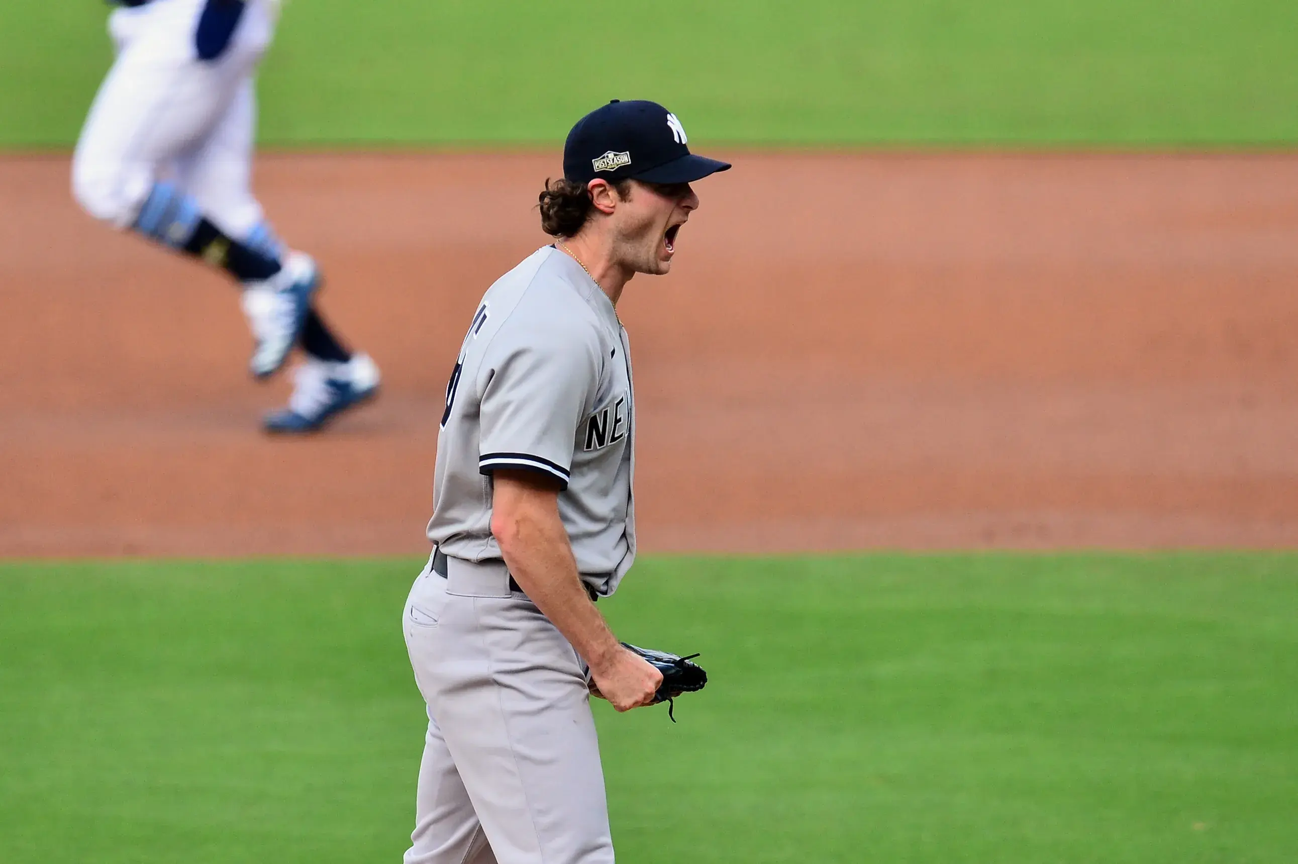 Oct 9, 2020; San Diego, California, USA; New York Yankees starting pitcher Gerrit Cole (45) reacts after striking out Tampa Bay Rays third baseman Joey Wendle (not pictured) with the bases loaded to end the first inning of game five of the 2020 ALDS at Petco Park. / Gary A. Vasquez-USA TODAY Sports