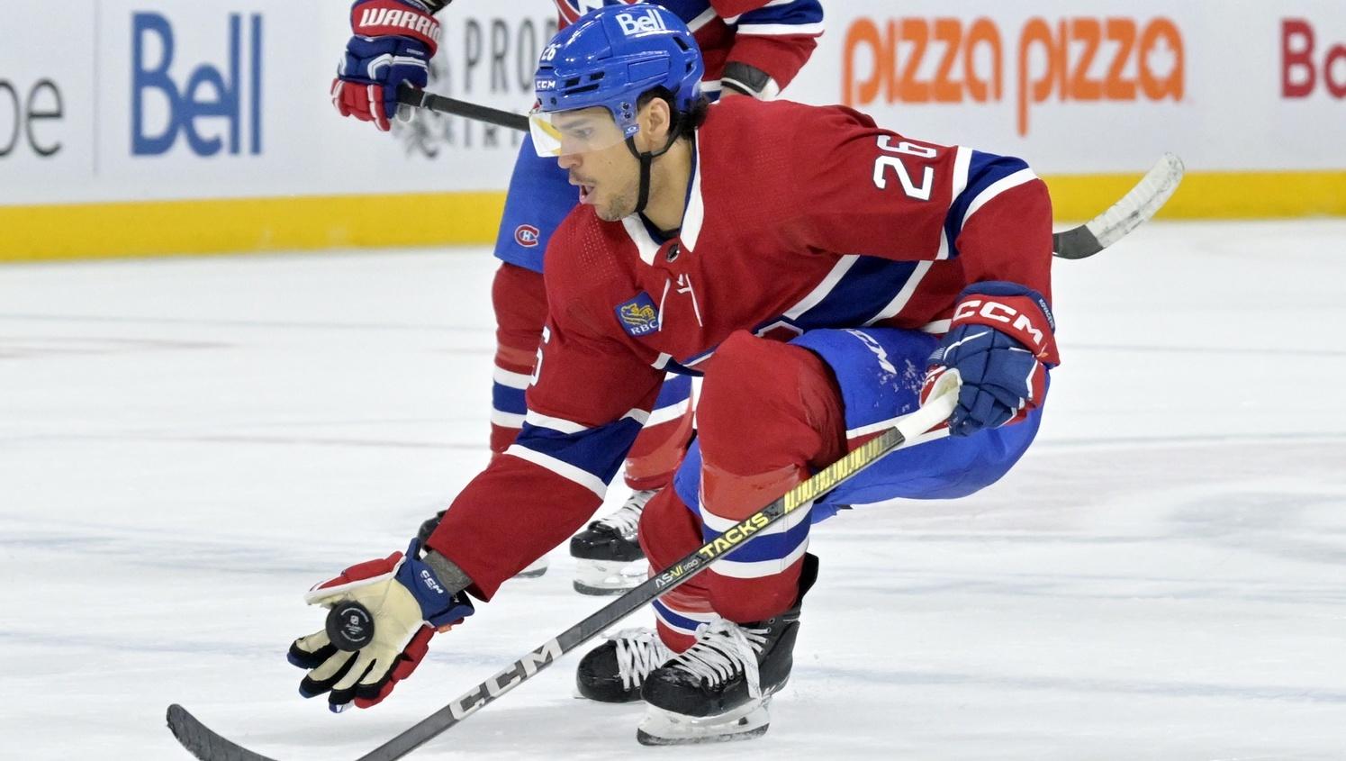 Montreal Canadiens defenseman Johnathan Kovacevic (26) intercepts a pass with his glove during the third period against the St.Louis Blues at the Bell Centre.