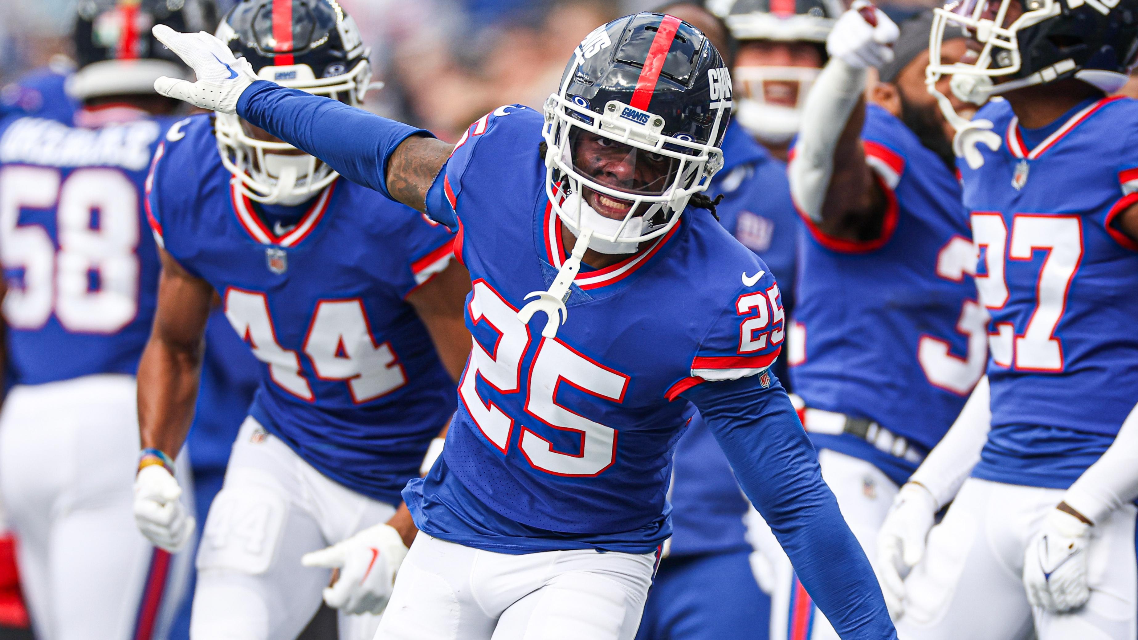 New York Giants cornerback Deonte Banks (25) celebrates after an interception against the Washington Commanders during the first half at MetLife Stadium