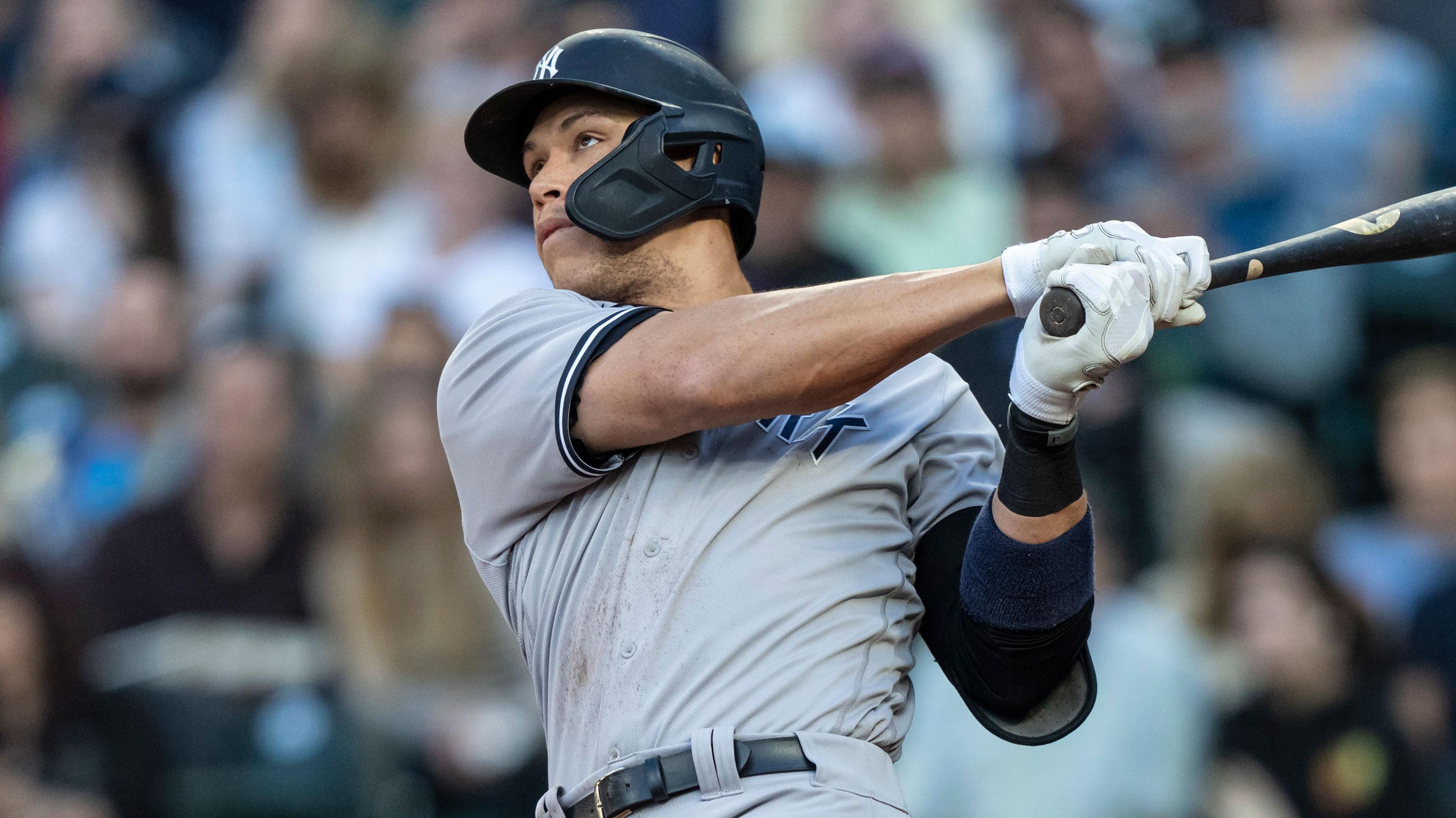 Jul 7, 2021; Seattle, Washington, USA; New York Yankees right fielder Aaron Judge (99) hits a two-run home run off of Seattle Mariners starting pitcher Yusei Kikuchi (not pictured) to score score leftfielder Tim Locastro (not pictured) during the second inning at T-Mobile Park.