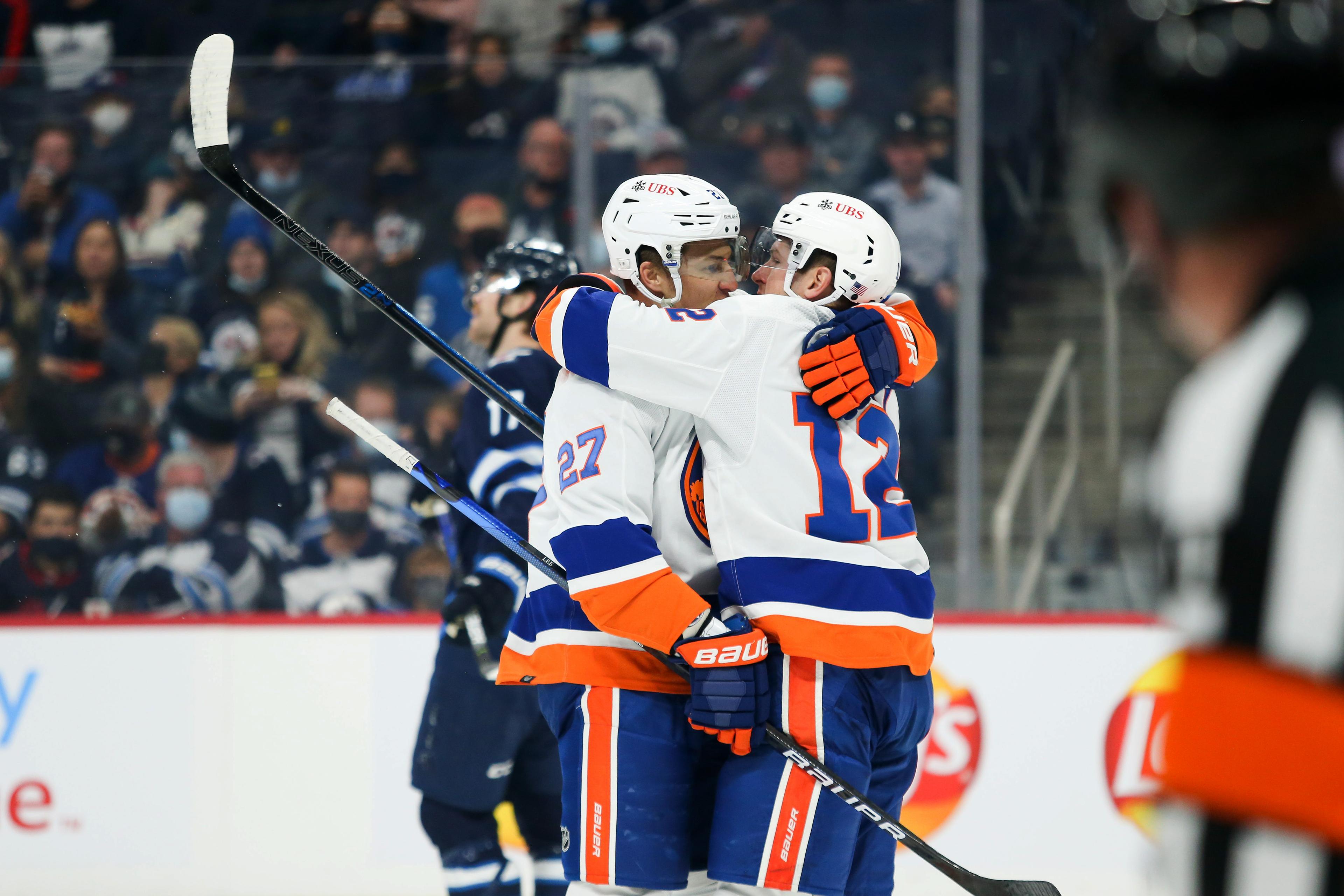 New York Islanders forward Anders Lee (27) celebrates with forward Josh Bailey (12) after scoring a goal against the Winnipeg Jets during the first period at Canada Life Centre.