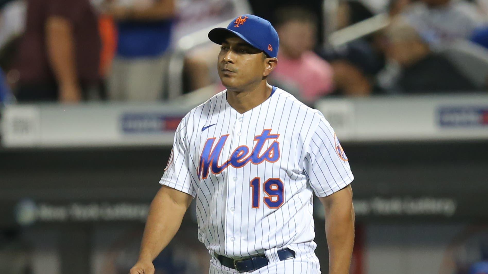 Aug 24, 2021; New York City, New York, USA; New York Mets manager Luis Rojas (19) walks to the mound to make a pitching change during the fourth inning against the San Francisco Giants at Citi Field. / Brad Penner-USA TODAY Sports